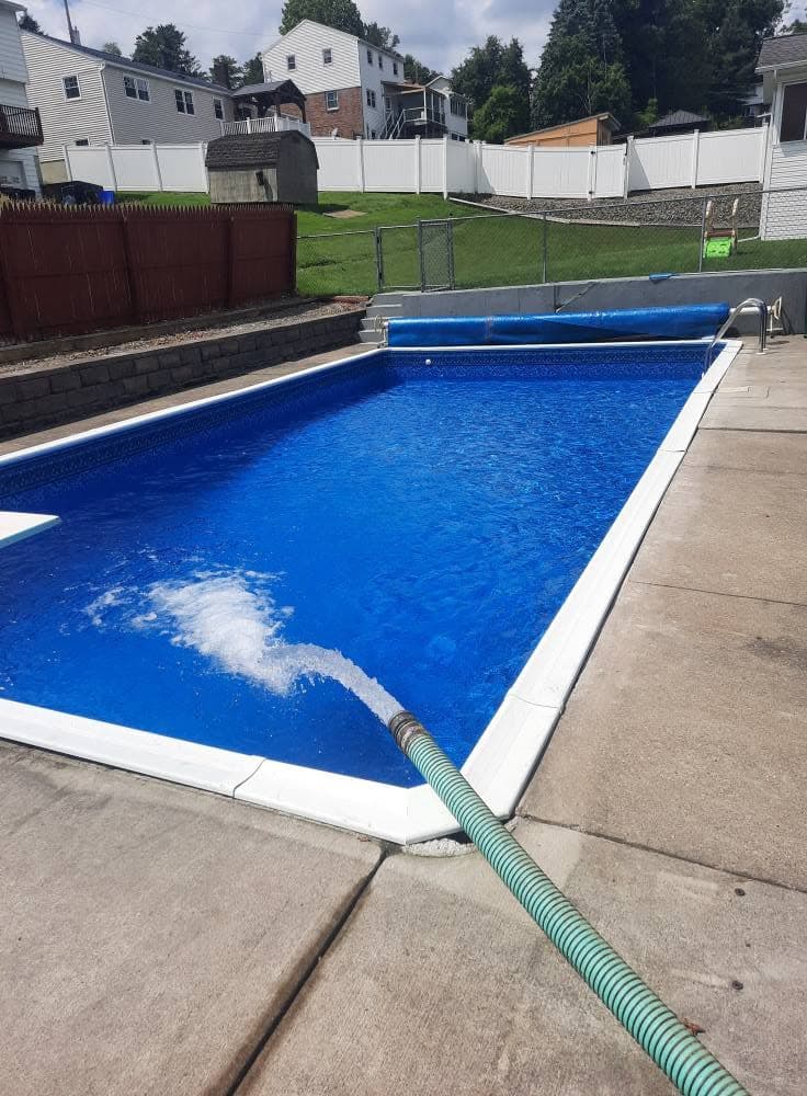 Finished pool with new liner filling with water