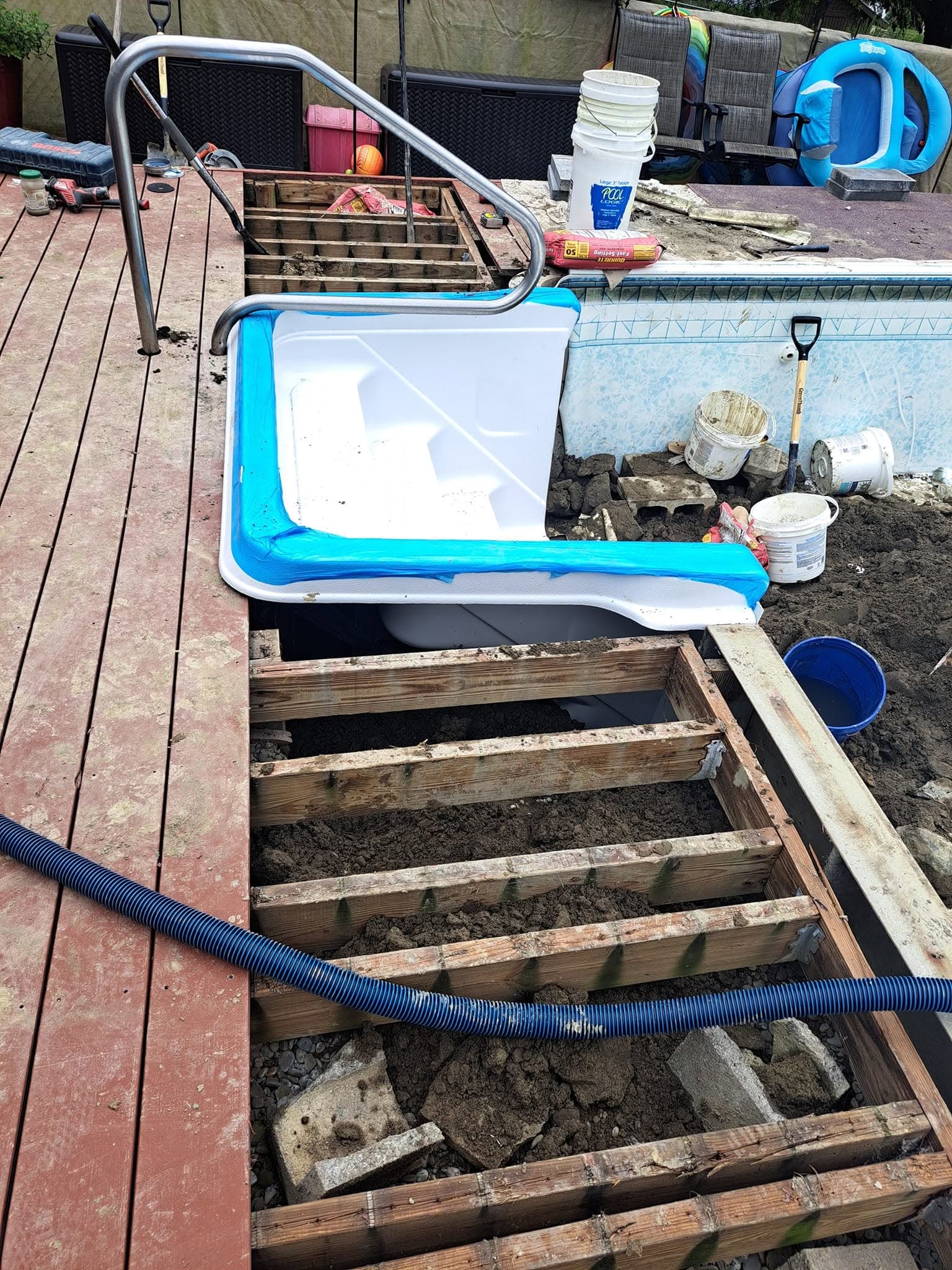 Old pool stairs removed with deck opened up to fix ground water underneath