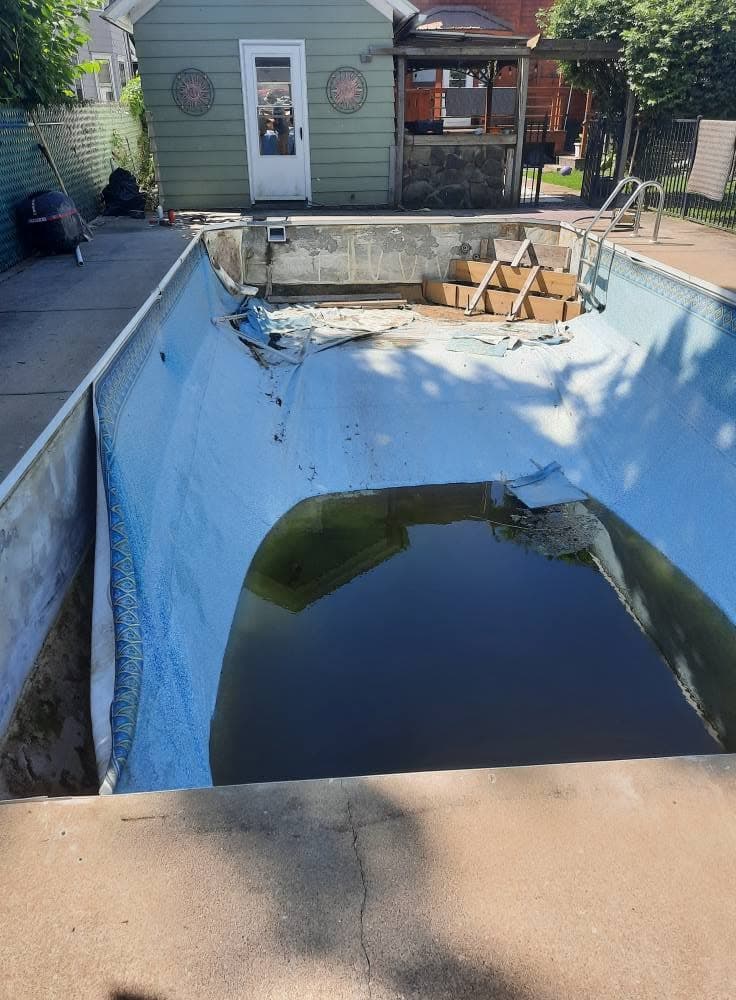 Pool before: sagging old liner with murky green water