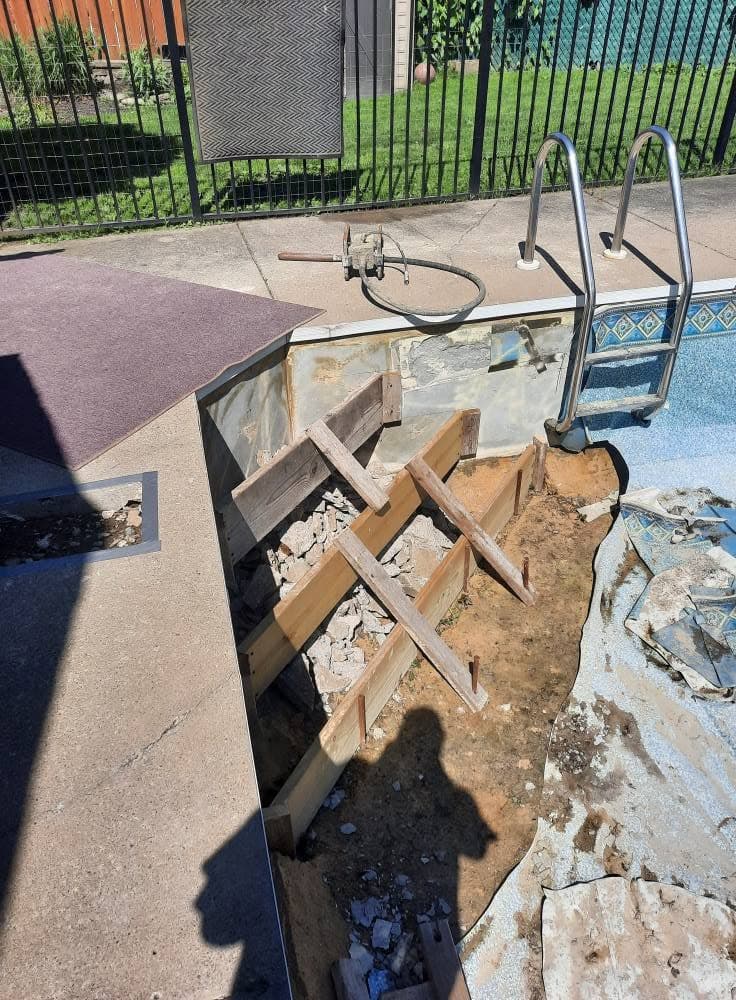 Wooden forms built for pouring new concrete pool steps
