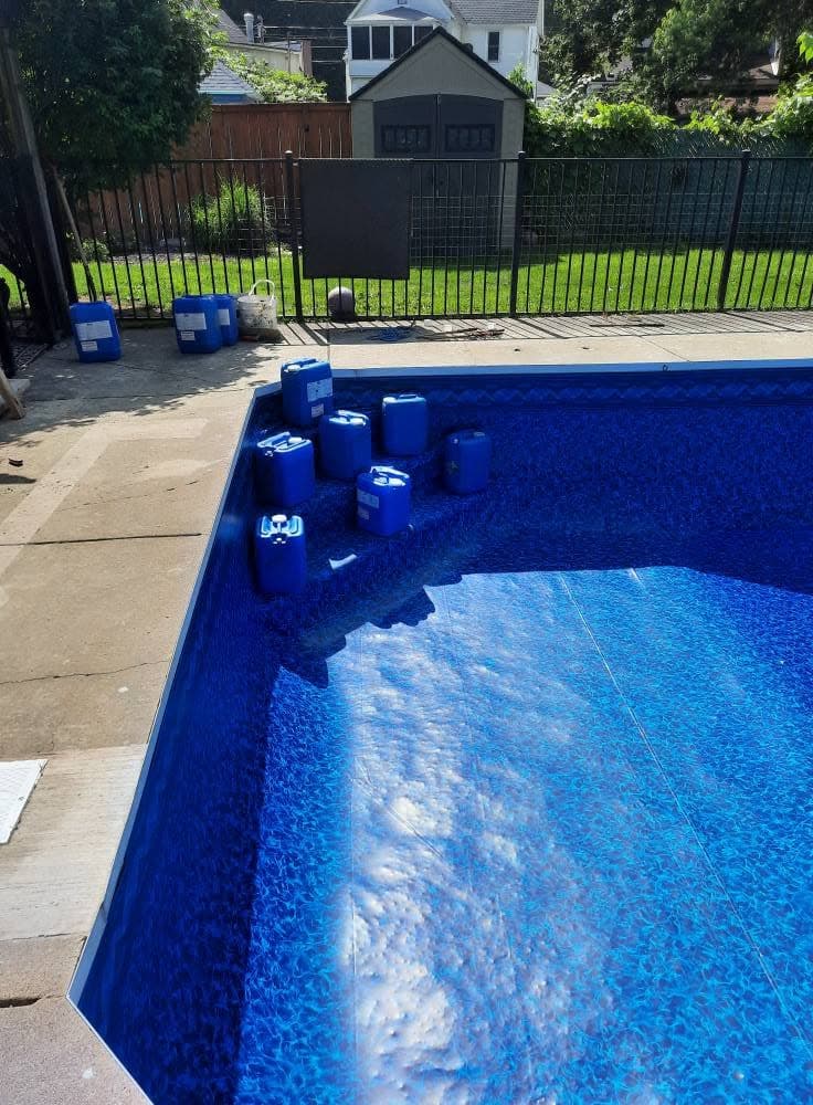 Finished concrete steps under water with the new liner installed
